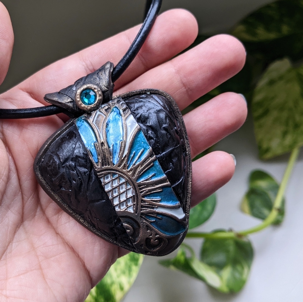 Necklace pendant with blue flower